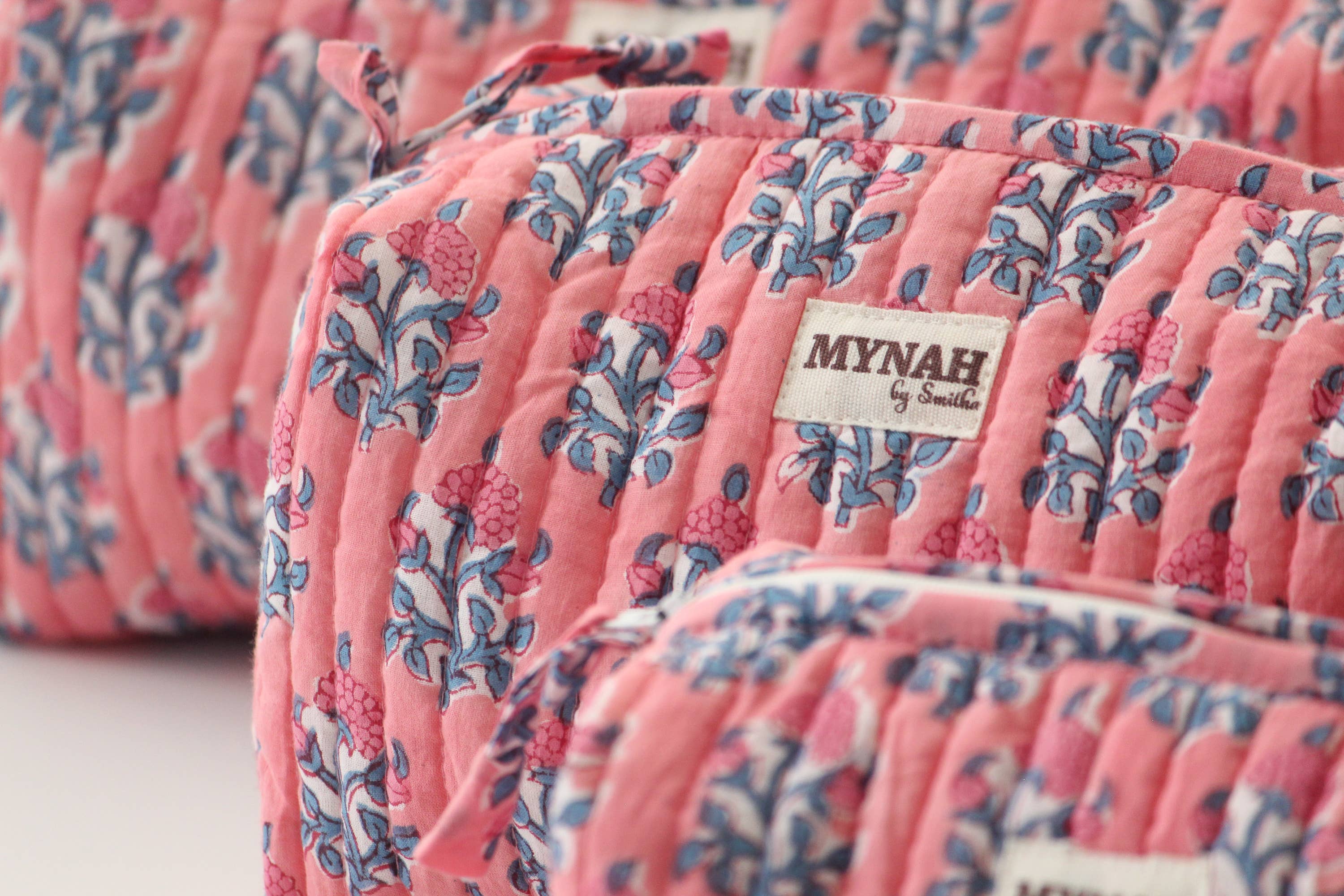 A single green leaf against a white background.