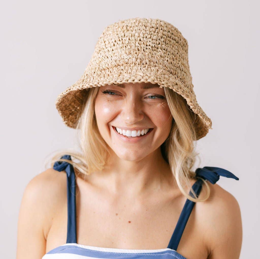 A single green leaf against a white background.