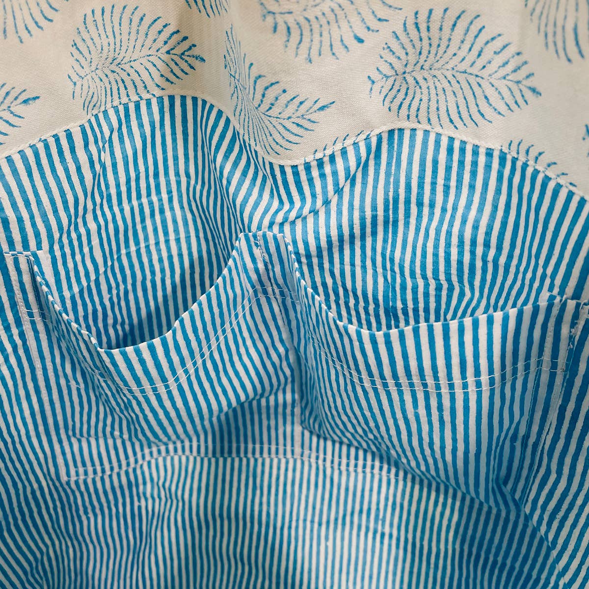 A single green leaf against a white background.